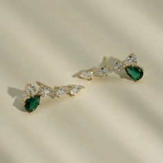 These stunning simulated diamond earrings offer a dazzling pear drop design, accented with either a luxurious pearl or vibrant emerald stone. Perfect for adding a touch of elegance to any outfit. 1'' Inch width Choose style below Earrings are final sale Jewelry Cleaning Solution, Hair Perfume, Drop Design, Emerald Stone, Drops Design, Small Jewelry, Cleaning Jewelry, Gold Plated Jewelry, Jewelry Plate