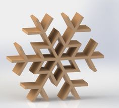 a snowflake made out of wood on a white surface with no people around it