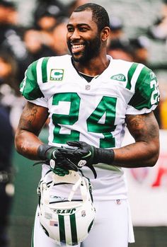 a close up of a football player holding a glove