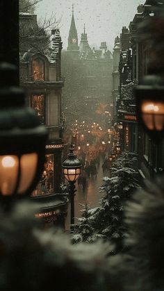 a city street filled with lots of snow covered buildings