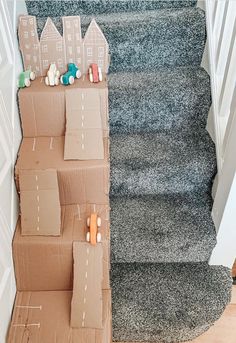 cardboard boxes are stacked up on the stairs