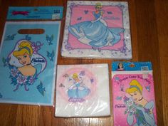 four princess themed bags sitting on top of a wooden table