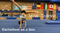 a person doing a handstand on a trampoline