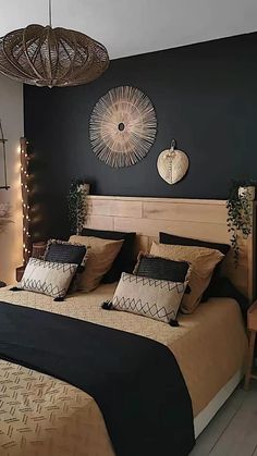 a bed with black and tan comforter in a bedroom