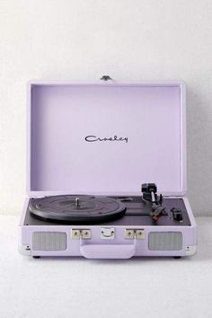 a record player in a suitcase with the lid open