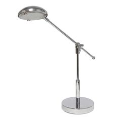 a metal table lamp with a circular base on an isolated white background for use as a desk light