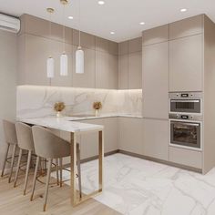 a modern kitchen with marble counter tops and beige cabinets, along with bar stools