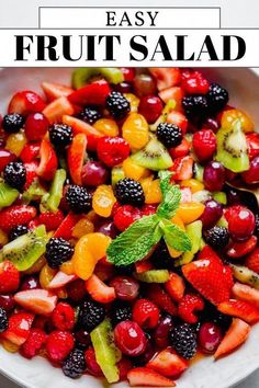 a white bowl filled with fruit salad on top of a table