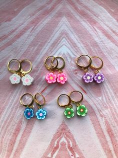 Flower Huggie Earrings 🌸 Perfect for summer, and for those aesthetic TikTok posts 😂 Available in 5 colours: White 🤍  Pink 💖  Purple 💜 Blue 💙 Green 💚 They come on gold plated huggie/ hoop findings.   £6 each 😊 The pair modelled is the maker's own pair and no pairs of earrings for sale are modelled in photos for hygiene reasons. Jewellery Summer, Summer Jewellery, Rose Violette, Hot Girl Summer, Earrings Summer, Aesthetic Tiktok, Summer Earrings, Summer Hot, Summer Earring