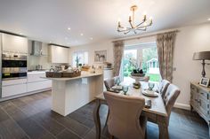 a kitchen and dining room with an open floor plan