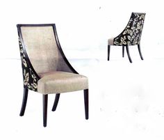 two chairs sitting side by side in front of a white background with black and gold designs