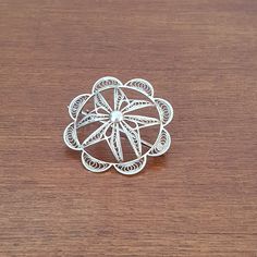 "A beautiful silver filigree brooch, with a long pin. The brooch is beautifully made and shaped as a Maltese cross in a dome shape with a scalloped boarder. Marked 925 on the C hook. There are also some other markings but I can't make them out. Condition:  In excellent vintage condition. Size: Diameter 3.5 cm (1 3/8\") This item will be carefully packaged in a box for safe shipping. Please contact me if you have any questions." White Gold Brooches With Intricate Design As Gift, Gift White Gold Brooches With Intricate Design, White Gold Brooches With Intricate Design For Gift, Ornate Filigree Round Brooches, Ornate White Filigree Brooches, Traditional Silver Filigree Brooch, Handmade Silver Pins, Ornate Sterling Silver Filigree Brooches, Silver Filigree Sterling Silver Brooch