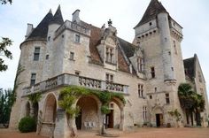 an old stone castle with ivy growing on it