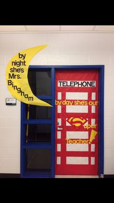 a door with two yellow and red telephones on the front, and another sign that says by night she's mrs bigham