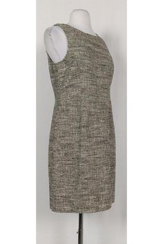 Look sleek and stylish in this black & cream tweed dress. It is a great transitional piece that can be worn from work hours to cocktail hour. Size 8 Knit textured fabric Rounded neckline Sleeveless Fitted at waist Unlined Above knee Bust 34" Waist 31" Shoulder to hem 34" Sleeveless Tweed Formal Dress, Chic Sleeveless Tweed Dress For Office, Fitted Sleeveless Tweed Dress For Formal Occasions, Formal Fitted Beige Tweed Dress, Sleeveless Tweed Dress For Formal Occasions, Formal Sleeveless Tweed Dress, Elegant Sleeveless Beige Tweed Dress, Elegant Sleeveless Tweed Dress For Formal Occasions, Formal Fitted Sheath Tweed Dress