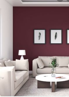 a living room with red walls and white furniture