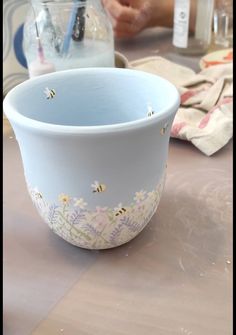 a blue bowl sitting on top of a table