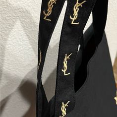 Very Light Ysl Tote Bag, Black Color With Embroidered Gold Ysl On The Strap And Side Of The Bag, With Pink Lining And One Pocket With Ysl Embroidered Label, Ckean And In Good Condition Ysl Tote Bag, Bags Ysl, Ysl Tote, Embroidered Labels, Yves Saint Laurent Bags, Tote Bag Black, Yves Saint Laurent, Black Color, Saint Laurent