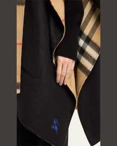 Burberry "Catherine" hooded check cape in cashmere     Approx. 87"L x 52.8"W    Side vents    Slip pockets    Hem rests below the hips     Made in Italy Designer Plaid Outerwear For Winter, Cashmere Cape, Burberry, Cape, Tops Designs, Cashmere, In Italy, Italy, Luxury Fashion