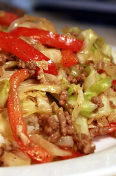 a close up of a plate of food with meat and veggies on it