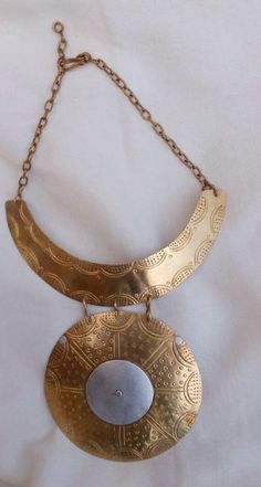 African women necklace. The necklace is well handcrafted using brass. Gift for her **This listing is for one necklace.** Custom orders are welcome. For more necklaces:- https://www.etsy.com/listing/907446756/african-women-neckace-pendant-choker?ref=shop_home_active_35 Dhl shipping express **Happy shopping!   Thankyou for visiting. Gold Medallion Necklace With Large Brass Pendant, Handmade Long Brass Chain Necklace, Handmade Brass Gold-tone Necklace, Handmade Brass Necklace In Gold-tone, Handmade Gold-tone Brass Necklace, Unique Gold-tone Brass Necklaces, Gold Necklaces With Large Brass Pendant, Gold Brass Necklace With Large Pendant, Gold-tone Brass Necklace With Large Pendant