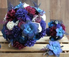 the bridal bouquets are purple, red and blue with white flowers on them