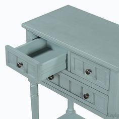 a grey wooden table with drawers on it