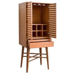 a wooden cabinet with drawers on one side and an open drawer on the other end