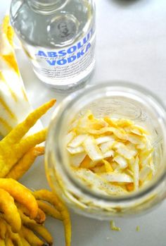 a jar filled with food sitting on top of a table next to a banana peel