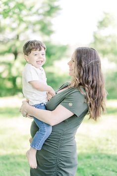 a woman holding a small child in her arms