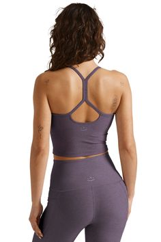 For essential style you can wear in and out of the studio, add the Slim Racerback Cropped Tank from Beyond Yoga to your workout wardrobe. Made of a soft heather performance fabric with moisture wicking, 4-way stretch, and a built-in shelf bra, this tank will keep you comfortable throughout your workouts. Wear this tank for yoga, barre, dance, and everyday style! Description: Fitted tank. Cropped length. Built-in shelf bra. Moisture wicking. 4-way stretch. Open back, with simple x-strap design. F Spring Crop Tops, Outfit With Jeans, Yoga Tank, Matching Leggings, Beyond Yoga, Fashion Night, Shelf Bra, Performance Fabric, Silhouette Design