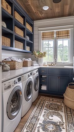 a washer and dryer in a room with wooden ceiling tiles on the floor