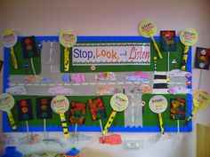 a bulletin board with lots of stickers on it that says stop look and listen