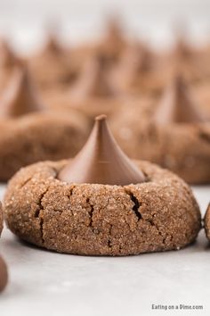 some cookies with chocolate frosting on top of each one in front of the other