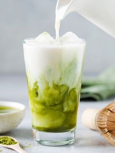 Soy milk pouring in matcha ice tea. Milk Pouring, Matcha Iced Tea, Matcha Health Benefits, Lemon Blueberry Pancakes, What Is Matcha, Yogurt And Granola, Matcha Green Tea Powder, Yogurt Parfait, Frothing Milk