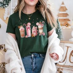 Embrace the holiday season with our cozy Hot Chocolate & Coffee Bella Canvas T-shirt! This festive shirt features a charming design of various hot drinks, candies, and flowers--perfect for spreading warmth and cheer without any text. The soft Bella Canvas 3001 fabric makes it ideal for layering or wearing on its own during chilly winter days. How to Order: - Choose Your Size: Available in a variety of unisex sizes. - Select Your Shirt Color: Choose from several seasonal colors to highlight the beautiful holiday drink design. - Double-Check Your Order: Before finalizing, make sure your selections are correct. Reach out if you have any special requests or questions! Production & Shipping: - Made to Order: Each shirt is printed on demand using Bella Canvas 3001, ensuring a high-quality produc Christmas Cotton T-shirt For Loungewear, Cute Holiday T-shirt For Winter, Cute Holiday T-shirt With Short Sleeves, Cute Winter Holiday T-shirt, Cute Short Sleeve T-shirt For Winter, Cute Winter T-shirt For Gift, Cute Holiday T-shirt With Crew Neck, Cute Winter Tops As Gift, Cute Winter Tops As A Gift