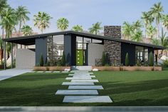 a modern house with grass and palm trees in the background