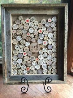 a wooden frame with lots of wine corks in it