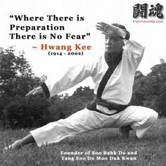 a man doing karate in the grass with an advertisement above him that reads, where there is preparation there is no fear