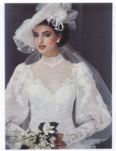 a woman in a wedding dress and veil