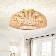 a living room filled with furniture and a large chandelier