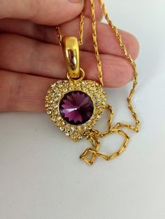 "Gorgeous piece of jewelry. NAPIER stamped unique chain. Gold-tone heart pendant stamped 290. Big diamond cut amethyst glass in the center with white crystals. Length; 16\" Ppendant:1.1/4\" x 1\" Perfect condition. Lovely gift. Thank you for visiting my store. You can also visit my MargaretJewelryShop or http://jewelryandclothing.net/" Heart-shaped Jeweled Jewelry Gift, Heart-shaped Jeweled Jewelry For Gift, Heart Shaped Jeweled Jewelry For Gift, Gold Heart-shaped Jeweled Jewelry, Gold Jeweled Heart Jewelry, Vintage Purple Heart-shaped Jewelry, Heart Pendant Necklace Gold, Blue Topaz Pendant Necklace, Big Light