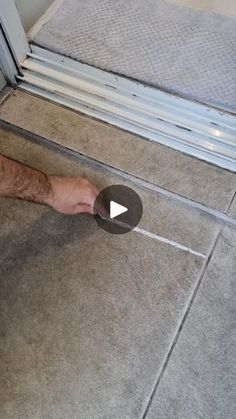 a man laying on the floor with his foot in front of an open sliding door