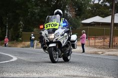 a police officer riding on the back of a motorcycle