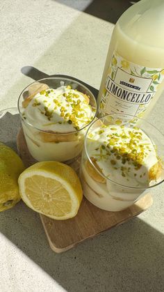 two desserts on a cutting board next to a bottle of lemonade