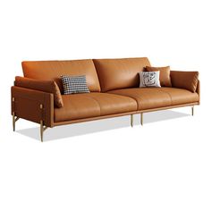 a brown leather couch with two pillows on it