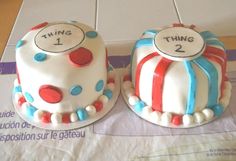 two decorated cakes sitting on top of a table