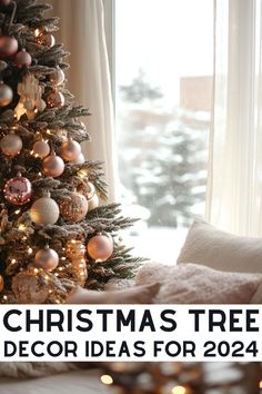 a christmas tree decorated with ornaments and lights in front of a window, with the words christmas tree decor ideas for 2014