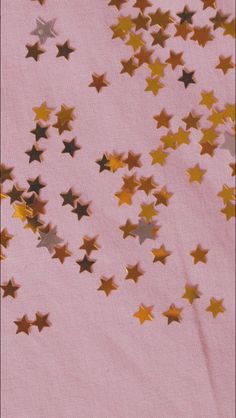 gold and silver stars on a pink background