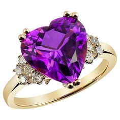 Here is an Amethyst ring you will love. Set with a natural gem that has the most exotic purple hues, it comes together with the 14K yellow gold holding the gems in place. Paired with immaculate diamonds that accentuate the ring on either side there is no doubt this ring is an elegant sparkler. A delightfully affordable choice, here is a present she will love. Ring Overview SKU 2669 Center Stone Amethyst Side Stones Diamonds Metal Type 14K Yellow Gold Metal Weight 3.80 gr Report N/A Size 6.75 Cen 14k Rose Gold Ring, Yellow Gold Earring, 14k White Gold Ring, Custom Engagement Ring, Amethyst Gemstone, The Purple, Amethyst Ring, White Ring, Diamond Heart